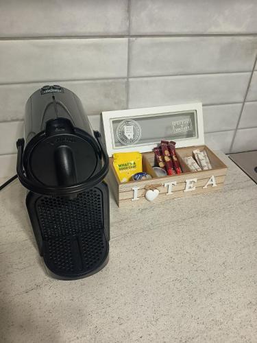 a blender sitting on the floor next to a box of medicines at Lemon Suites 2 in Mytilini