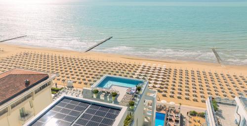 an aerial view of a hotel on the beach at Victoria Frontemare Beach & Spa Hotel Jesolo in Lido di Jesolo