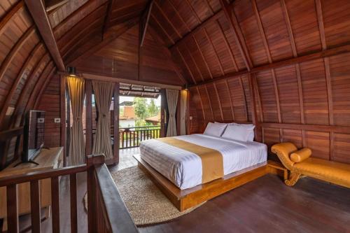 Кровать или кровати в номере Banjar Segara Villa & Guesthouse - Kelating