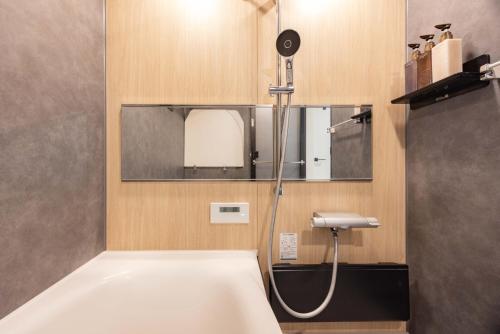 a bathroom with a shower and a sink at First Choice in Tokyo