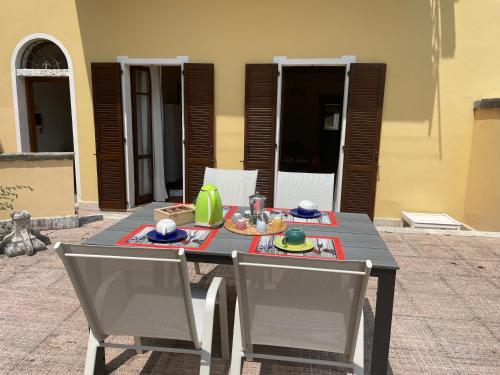 a table and chairs with food on top of it at Once upon a time in Domaso