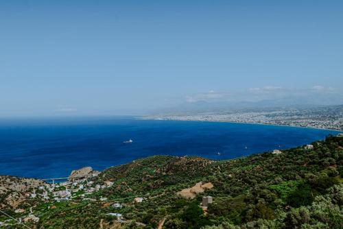 a view of the ocean from the top of a mountain at OntasView Rodia in Rodia