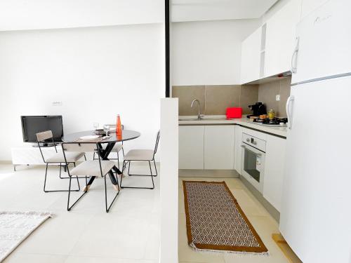 Η κουζίνα ή μικρή κουζίνα στο Petit Cocon Neuf et Stylé à la Marsa