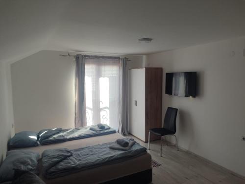 Postel nebo postele na pokoji v ubytování Apartmani Hub