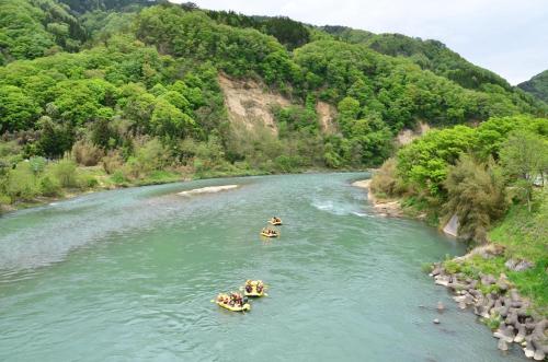 a group of people rafting down a river at UNPLAN Residence suite in Chikuni