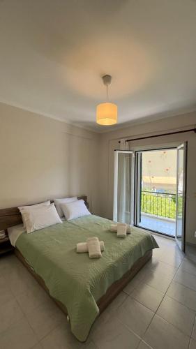 Ένα ή περισσότερα κρεβάτια σε δωμάτιο στο Makis Apartments