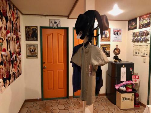a mannequin in front of a door in a room at ドッグランドサムデイ in Minamitsuru
