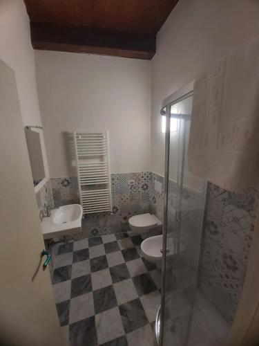 a bathroom with two toilets and a shower at Albergo Palazzo Costa in Beverino