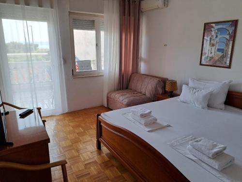 Postel nebo postele na pokoji v ubytování Pansion Ivana studios