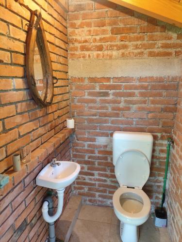 a bathroom with a toilet and a sink at Oaza mira Šipovo in Šipovo