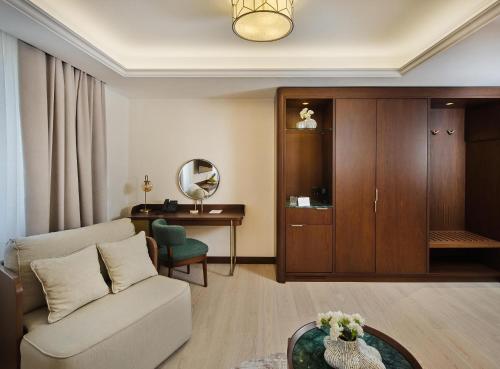 a living room with a couch and a table at Palazzo President in Split