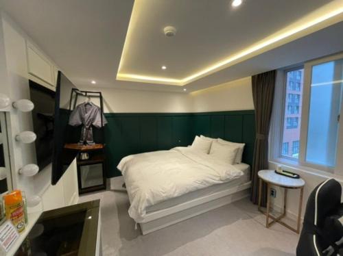 Postel nebo postele na pokoji v ubytování C-line Hotel