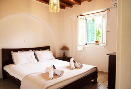 Ένα ή περισσότερα κρεβάτια σε δωμάτιο στο Horizon Nest Mykonos Ornos!