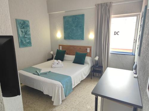 Кровать или кровати в номере Hotel Don Cándido