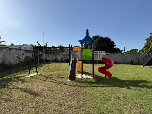 a park with a playground with a slide at Suite Oasis at the Vineyards at Deanery in Kingston