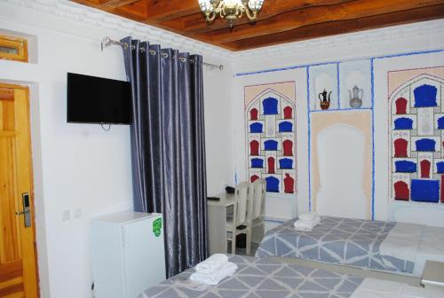 Ένα ή περισσότερα κρεβάτια σε δωμάτιο στο AIST Boutique in Historical Caravan Sarai XIX Century