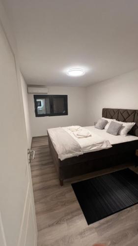 a bedroom with a large bed in a room at White house Paradise in Bihać
