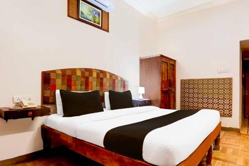 Ένα ή περισσότερα κρεβάτια σε δωμάτιο στο Hotel O Rai Ka Bagh Near Railway Station
