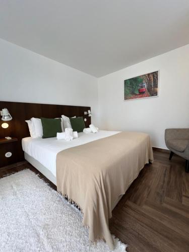 a bedroom with a large bed in a room at Quinta Pedra Firme in Sintra