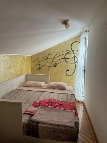 Postel nebo postele na pokoji v ubytování Apartman Mimi