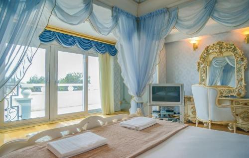 a bedroom with a bed and a large window at Vila Chiara in Makarska