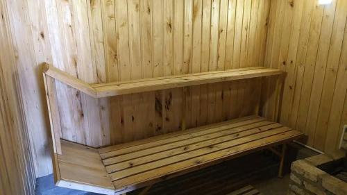 a wooden sauna with a wooden bench in it at Arabachyan guest house in Aygut