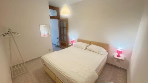 Ένα ή περισσότερα κρεβάτια σε δωμάτιο στο VILLA MARIA e SUITE