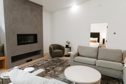 a living room with a couch and a fireplace at Nature Link Resorts in Nisswa