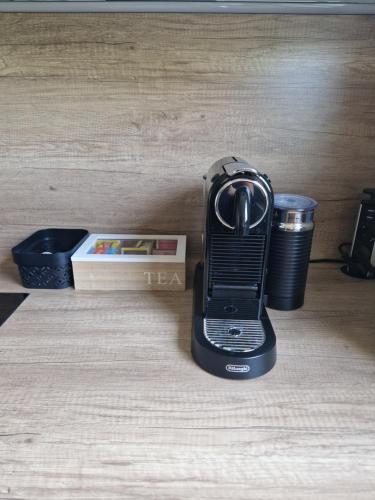 a black cell phone sitting on top of a table at Filder Apartment in Ostfildern