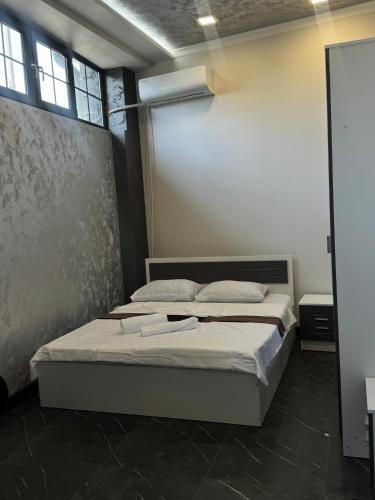 a bedroom with two beds in a room at AlenAr Hotel in Yerevan