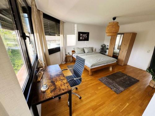 a living room with a bed and a table at Luxurious Apartment in Leverkusen in Leverkusen