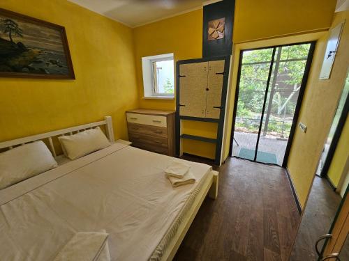Postel nebo postele na pokoji v ubytování Guest House Filin