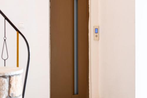 a close up of a door with a handle at Stone Palace Hotel Near Athen's Airport Free Shuttle From and to Athen's Airport in Spáta
