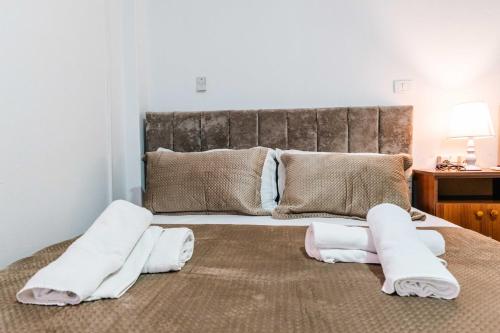 Llit o llits en una habitació de KURTI Hotel