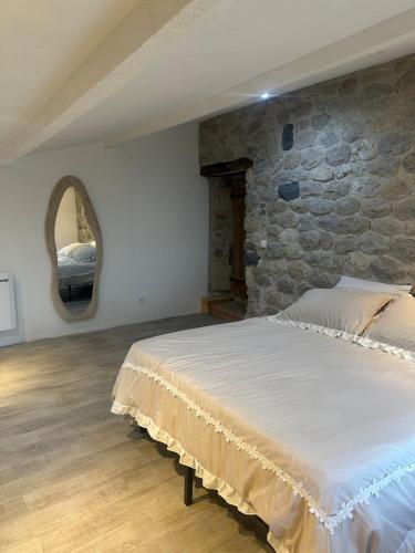 Cama o camas de una habitación en Gîte du Hameau