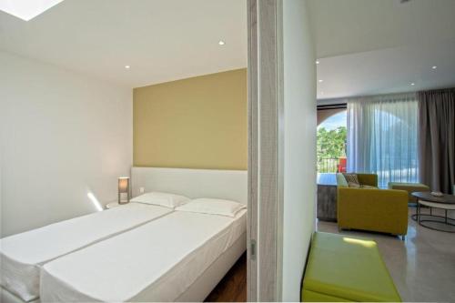 Ένα ή περισσότερα κρεβάτια σε δωμάτιο στο Appartement E RONDINELLE 3