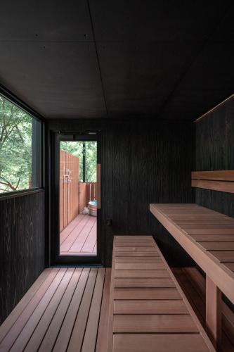 a room with a wooden deck with a large window at コトトキス in Shizuoka
