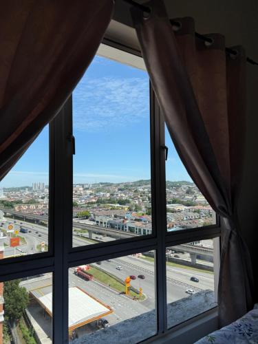 a view of a city from a window at Cozy Stay -APU, Bukit Jalil, UPM in Serdang