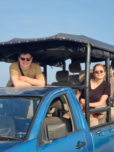 two people sitting in the back of a car at Traget safari home stay in Udawalawe