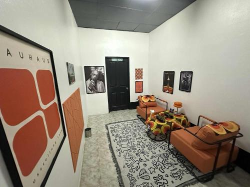 a room with two couches and a black door at Andaman Genetics 420 Rooms in Ao Nang 