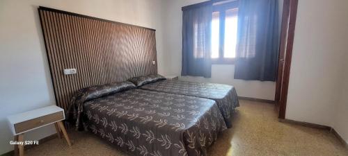 Posteľ alebo postele v izbe v ubytovaní Apartamento centro de peñíscola CASA KIKO