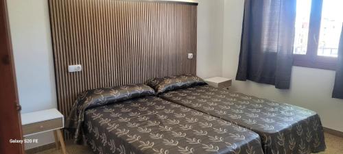 Posteľ alebo postele v izbe v ubytovaní Apartamento centro de peñíscola CASA KIKO