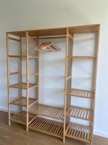 a shelf in a room with wooden shelves at U M I surf yoga suite Doniños beach in Ferrol