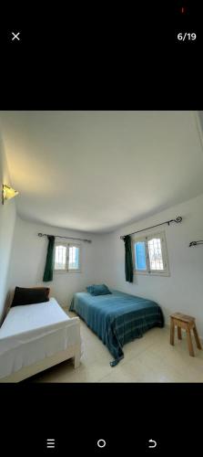 Cama ou camas em um quarto em Houchna