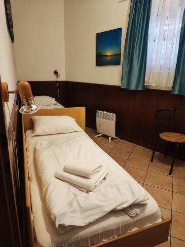 Ένα ή περισσότερα κρεβάτια σε δωμάτιο στο Arcobaleno Apartments
