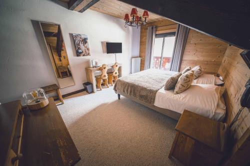 Postel nebo postele na pokoji v ubytování Chalet Hôtel Les Airelles