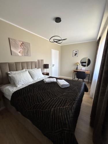 Postel nebo postele na pokoji v ubytování Apartament Symsar