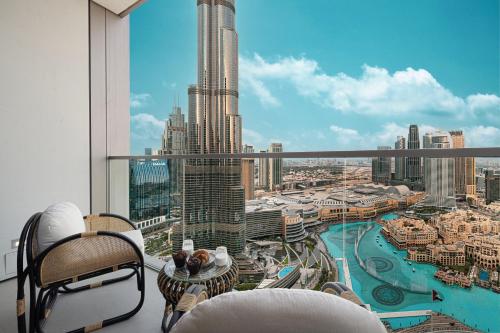 a balcony with a view of a city skyline at Sky-High Luxury 2BR Burj View Walk Dubai Mall in Dubai