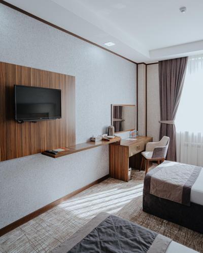 Postel nebo postele na pokoji v ubytování Volga Hotel Baku
