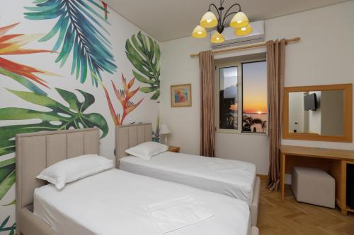 Postel nebo postele na pokoji v ubytování Le Palazzine Hotel